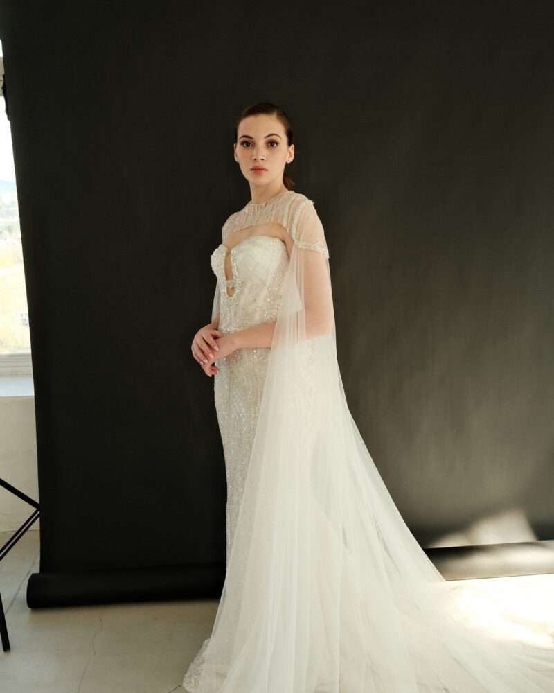 Crystal wedding dress with cape overlay, strapless design, elegant silhouette, Gilded Grace Photo 05