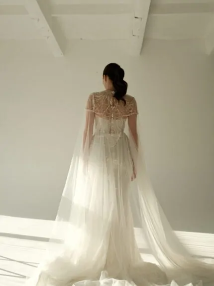 Crystal wedding dress with cape overlay, strapless design, elegant silhouette, Gilded Grace Photo 04