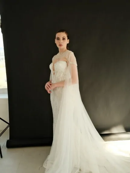 Crystal wedding dress with cape overlay, strapless design, elegant silhouette, Gilded Grace Photo 05